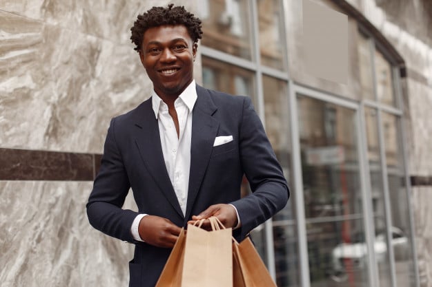 Man with shopping bags. Image from https://nohat.cc/f/stylish-black-man-in-a-city-with-shopping-bags-free-photo/56962206f5f745f480d3-202004210825.html