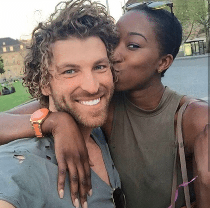 Black woman, white man portrait kissing -Marriage on a whim - vegas wedding romance