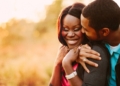 Happy black couple embracing - formula for happy relationship