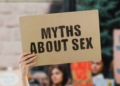 Cardboard with words 'myths about sex' - common sex myths